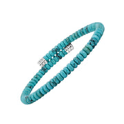 Turquoise-blue disc bead open bracelet with dark veining and polished silver-tone end caps