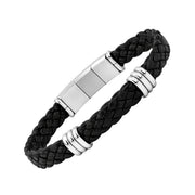 Angled view of a black braided leather bracelet with silver-tone triple-ring accents and polished clasp